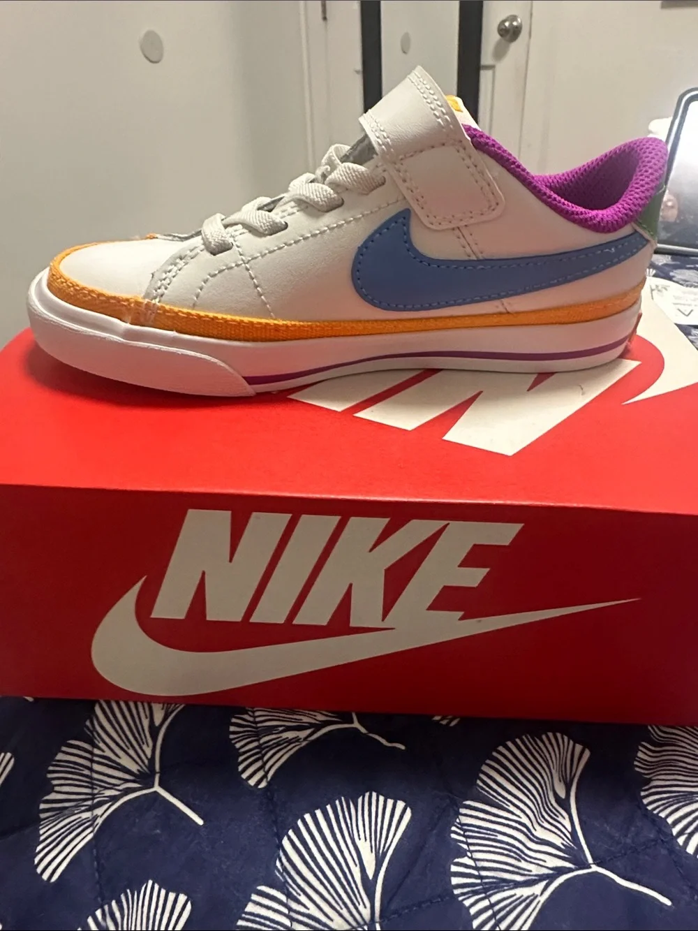 Nike Kids White Sneaker with Blue Swoosh and Purple Lining
